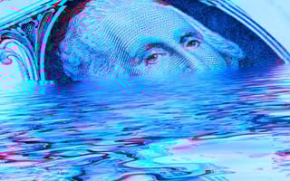 a large U.S. dollar bill sinking in water