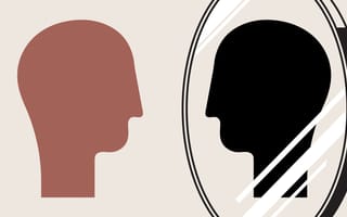 A person looking into a mirror seeing a skewed version of themselves representing their level of self-awareness.