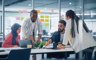 A product team working together in a conference room.