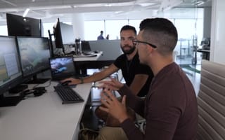 travelers haven team members working at a computer