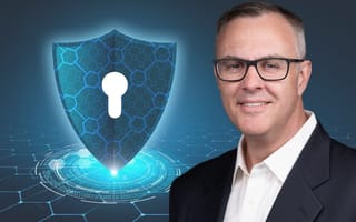 Cybrary CEO Kevin Hanes on a blue background with a lock symbol.