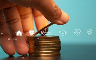 Hand placing coins in a stack behind various insurance icons