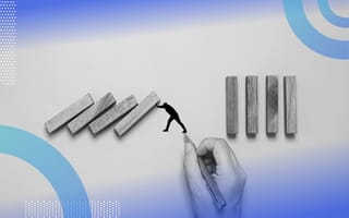 A hand draws an illustration of a man holding up several half-fallen dominoes. /diversity-inclusion/6-actions-for-executives-dei