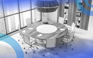 A 3D mockup of an office featuring a round office table surrounded by empty chairs and a city skyline outside the windows. /company-culture/redesign-office-for-collaboration