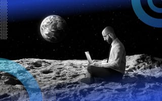 A man works on a laptop on the moon with the earth in the background
