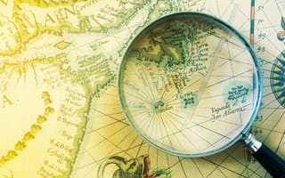 Antique map and magnifying glass