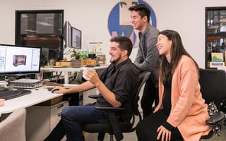 Million Dollar Baby Co. team members working on a project together