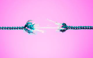 Thread beginning to unravel with pink background