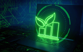 A bar graph with a leaf icon on a laptop representing the increasing benefits of green computing.