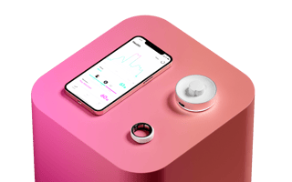 The Happy Ring, pictured with its charger and smartphone app.
