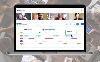 headroom platform on a laptop overlaid a company meeting