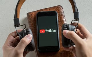 The YouTube app between over-ear headphones