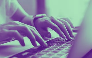 person typing on laptop keyboard