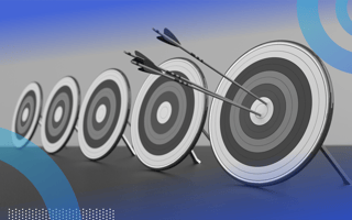 Five targets are lined up, with several arrows in the center of the nearmost one. /product-management/5-goals-free-trials