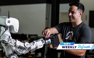 Apptronik’s human-like robot giving a package to a human employee.