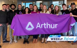 Arthur team with banner