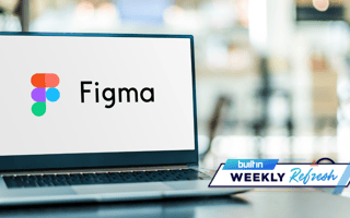 Figma's logo on a laptop screen resting on a desk.