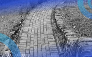 A paved footpath cuts through a grassy field. /software-engineering-perspectives/python-pathlib