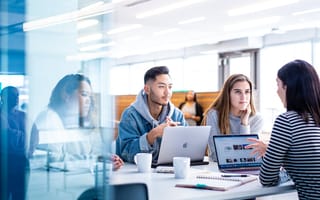 Cisco Meraki's team collaborates in a modern office