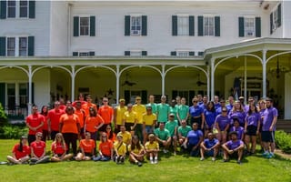 Landis' team gathers outside for a group photo