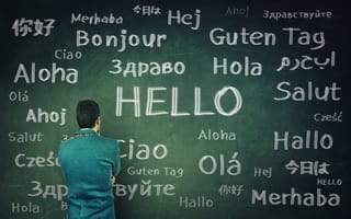 Man looking at different words that mean hello in many languages.