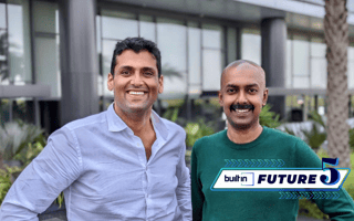 TeamOhana co-founders Tushar Makhija and Baishampayan Ghose pose for a photo outside.