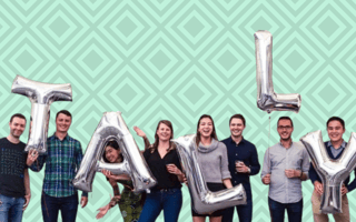 The Tally team holding balloons that spell “Tally”