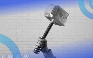 A hand holding Thor's hammer Mjolnir