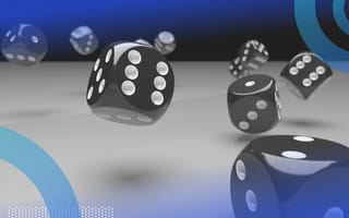 A group of dice rolling across a table.