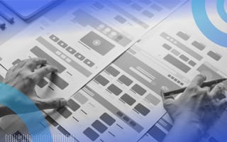 Experience Design Is Everything A close-up of a designer's hands holding a pen and working on design markups