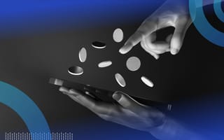A hand operates a smartphone with coins floating above it