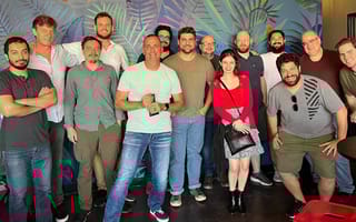 brinqa colleagues gathered together