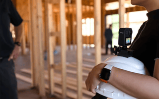 At Mosaic, Pieces of Data are Bringing the Company’s Vision to Life A construction worker holds a hard hat on site.