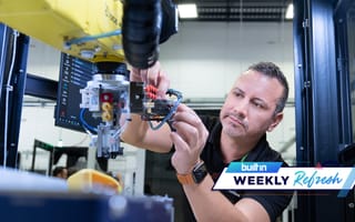 A Bright Machines employee works on a device.