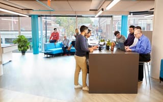 A group of Kensho employees work in their Cambridge, MA, headquarters