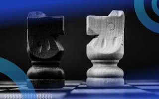 Two knight chess pieces square off representing dominated strategy