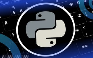 The python logo over a keyboard.