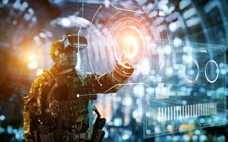 A soldier in uniform works with complex tech.