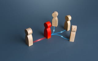 Wooden people in a tree-shape. One wooden person connects via red line on the ground to a red wooden person, who then branches out to three more connected by blue lines.