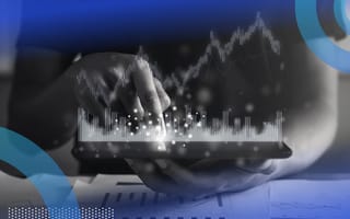 A data scientist using data visualization software on a tablet.