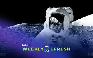 An astronaut on the moon with ICON’s structure in the masks reflection.