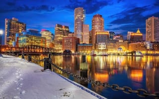 The Boston skyline reflects on the harbor