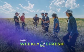 The Mad Capital team talking with farmers in a field.