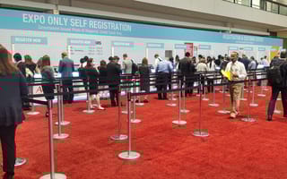 Attendees line up to register for an event