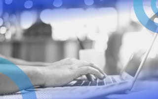 Intranet image of two hands typing on a laptop in profile.