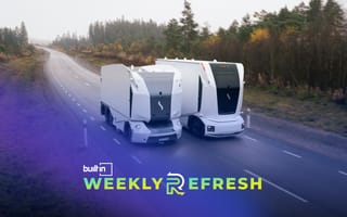 Einride’s autonomous, electric freight trucks drive on a road.