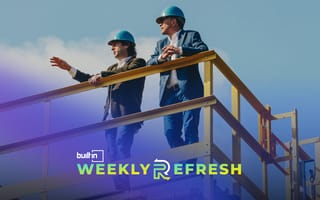 Group14 Technologies staffers stand outside with hard hats on