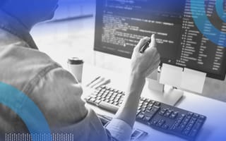 Source Code person looking at code on monitor