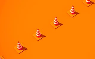 A line of cones setting up a work boundary.