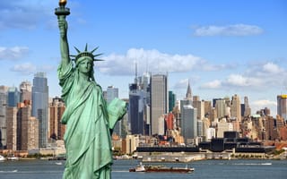 The Statue of Liberty is pictured in front of the NYC skyline.